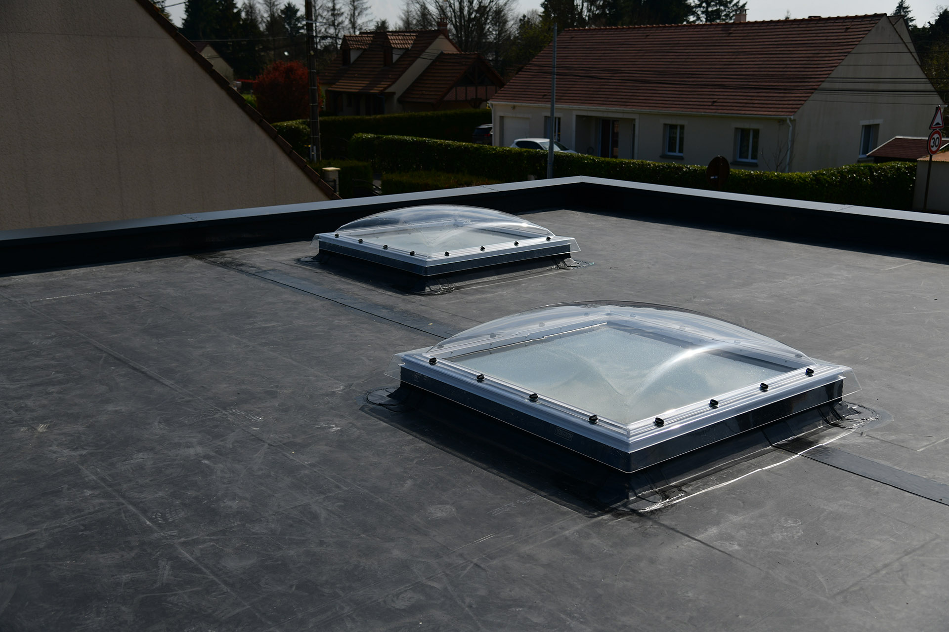 two roof lanterns on a rubber roof